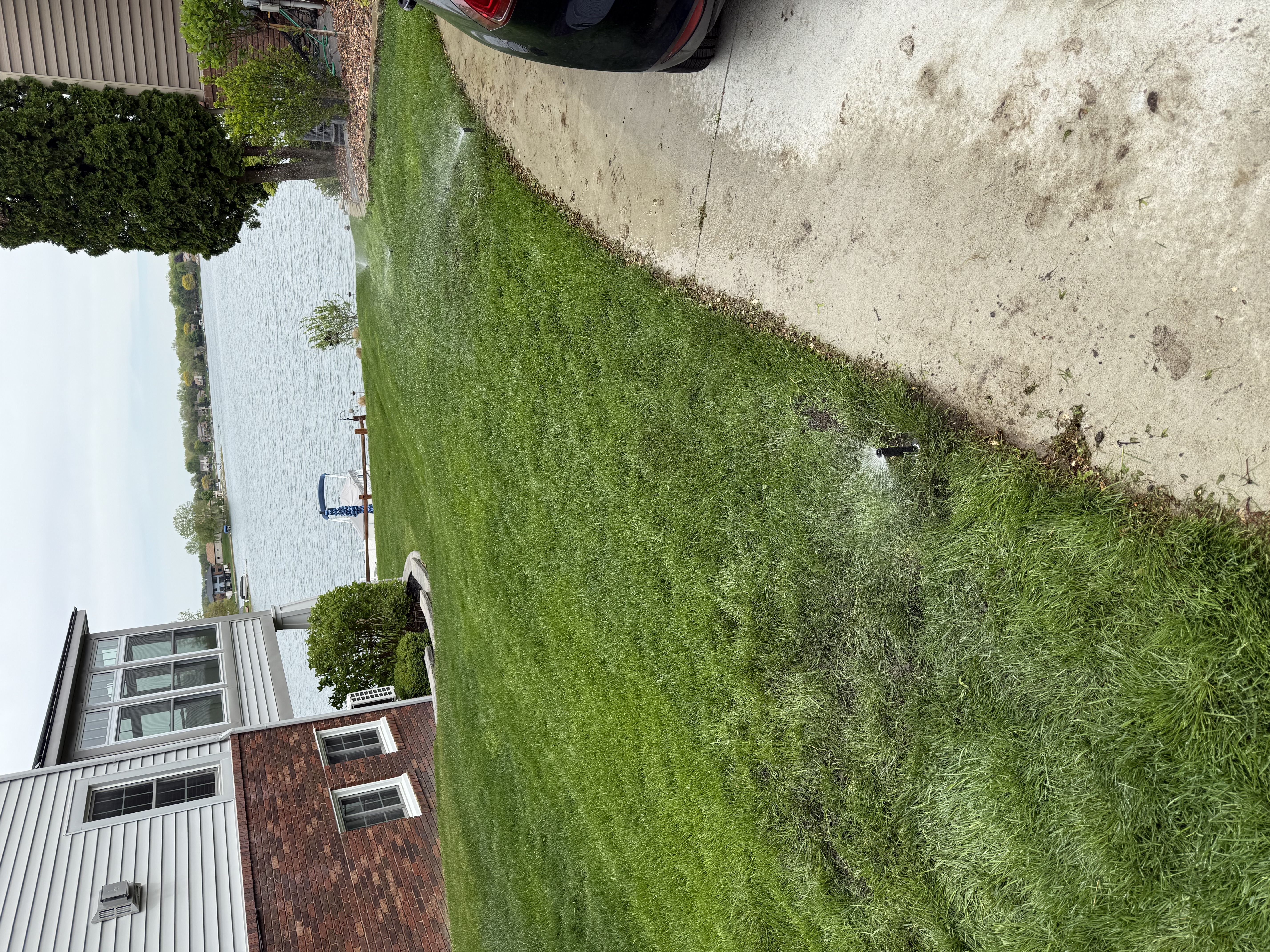 Beautifully maintained lakefront lawn with sprinkler system