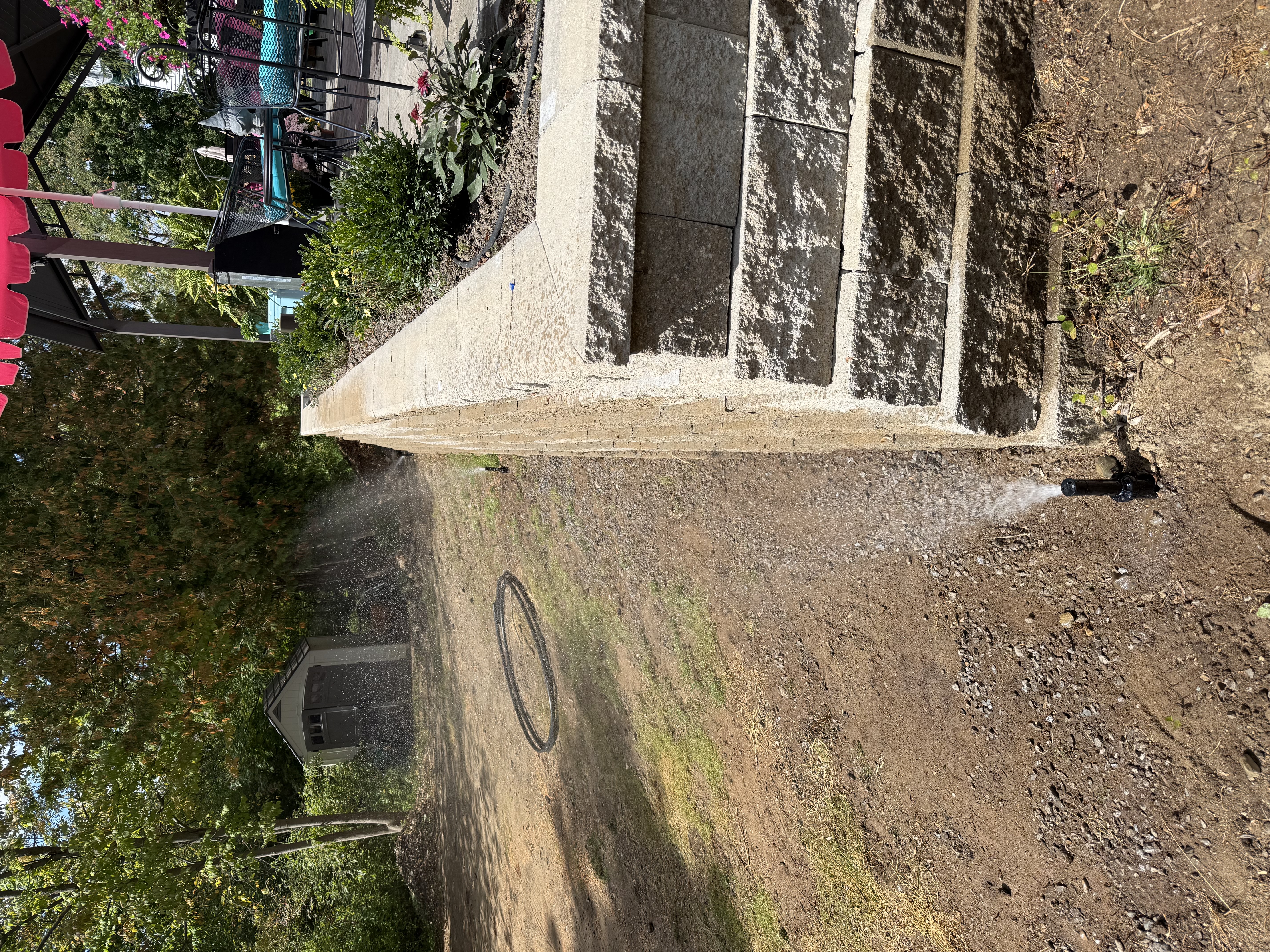 Professional irrigation work by Ryan's Irrigation showing sprinkler system in operation